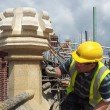 Workman restoring chimneys on Jesus College Cambridge